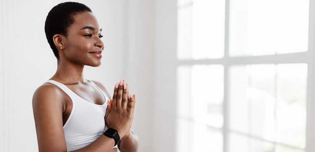 Representational image of a woman practicing Reiki Meditation